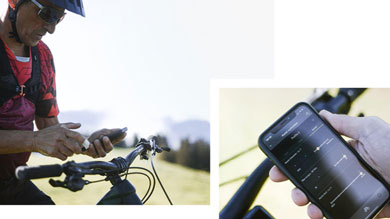 Cyclist using a smartphone app to adjust bike settings