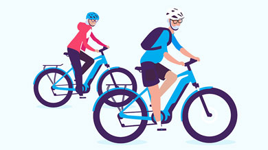 Two people riding bicycles, both wearing helmets and casual attire.