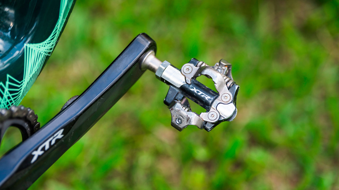 Close-up of a bicycle pedal with XTR branding
