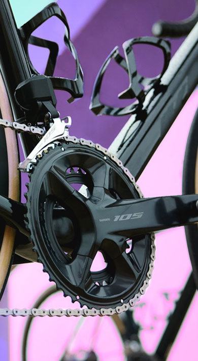 Close-up of a bicycle drivetrain with colorful background