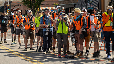 Photographers standing around the finish line at Unbound gravel 2024