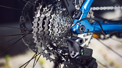 Close-up of a bicycle rear derailleur and cassette